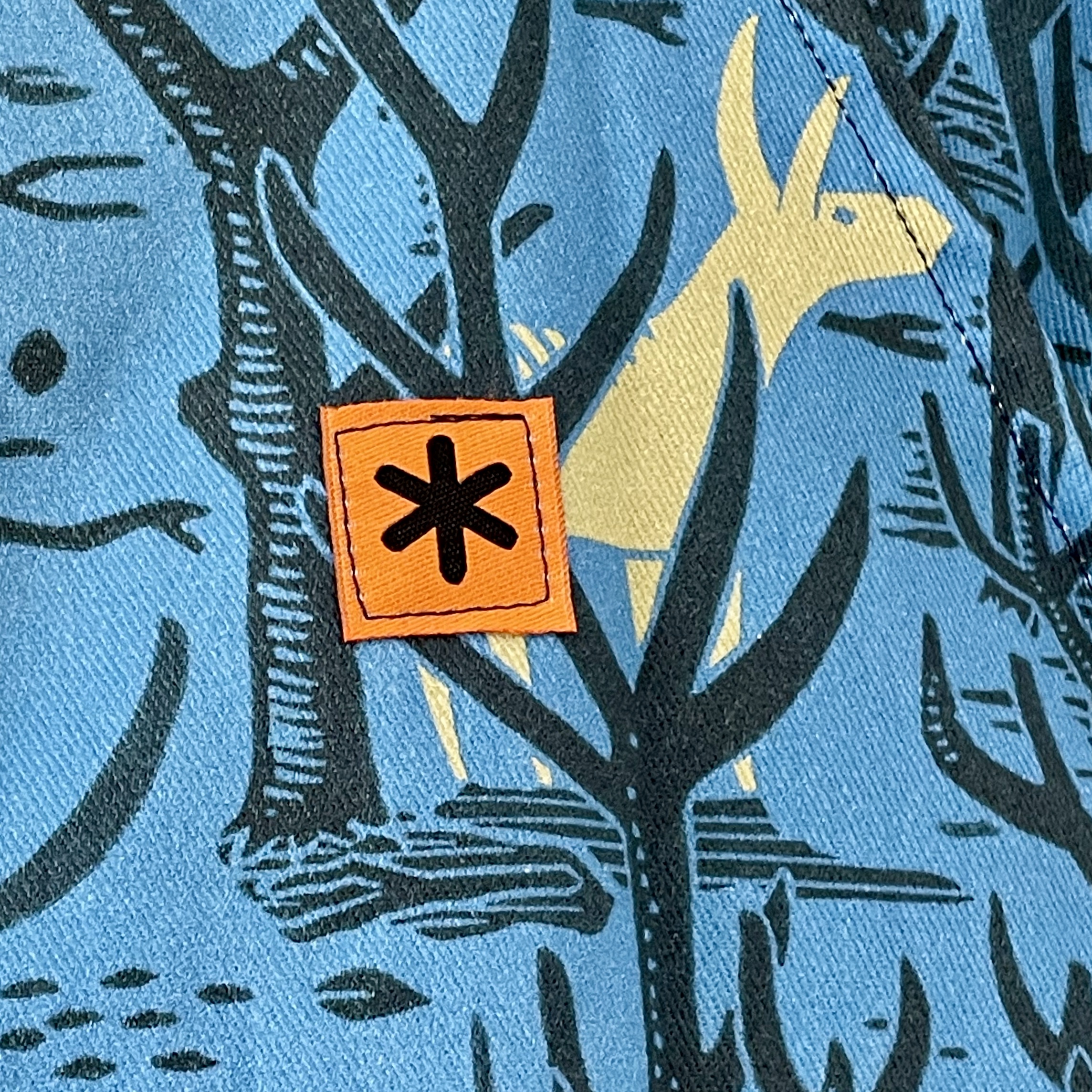 James Green Prints Donkey Woods Fabric Detail with The Stitch Society Logo
